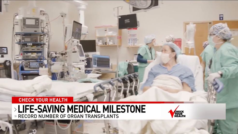 Program for transplant patients hold old hearts in hands