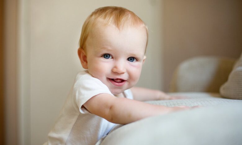 When do babies stand