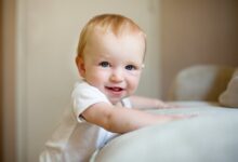 When do babies stand