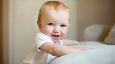 When do babies stand